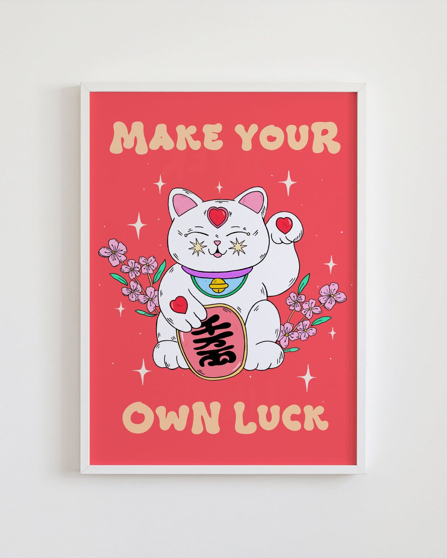 Framed poster with a cartoon cat holding flowers and text 'Make Your Own Luck' on a red background.
