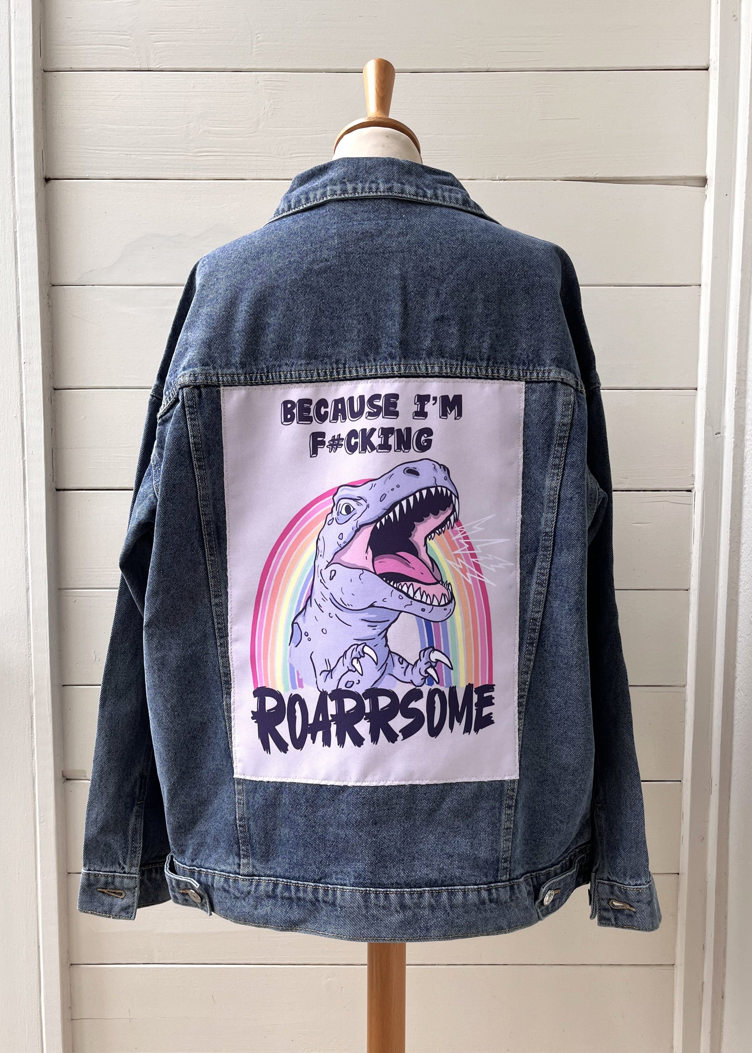 T-rex illustration on denim jacket