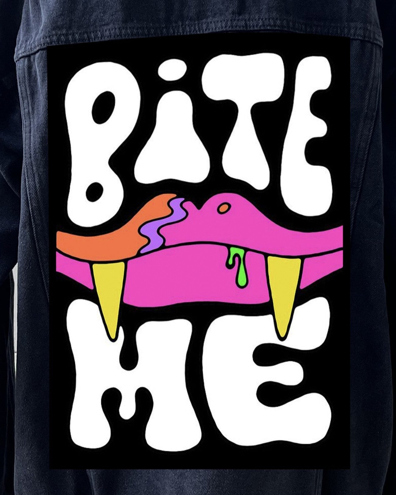 A patch with a graphic design featuring stylized text and a tongue with a 'Bite Me' slogan on a black background.