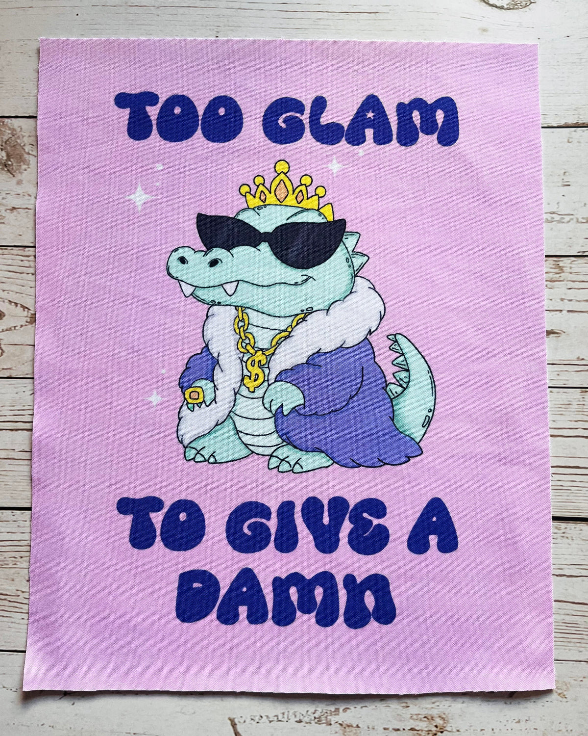 Cartoon alligator with a crown and sunglasses on a purple background with text.