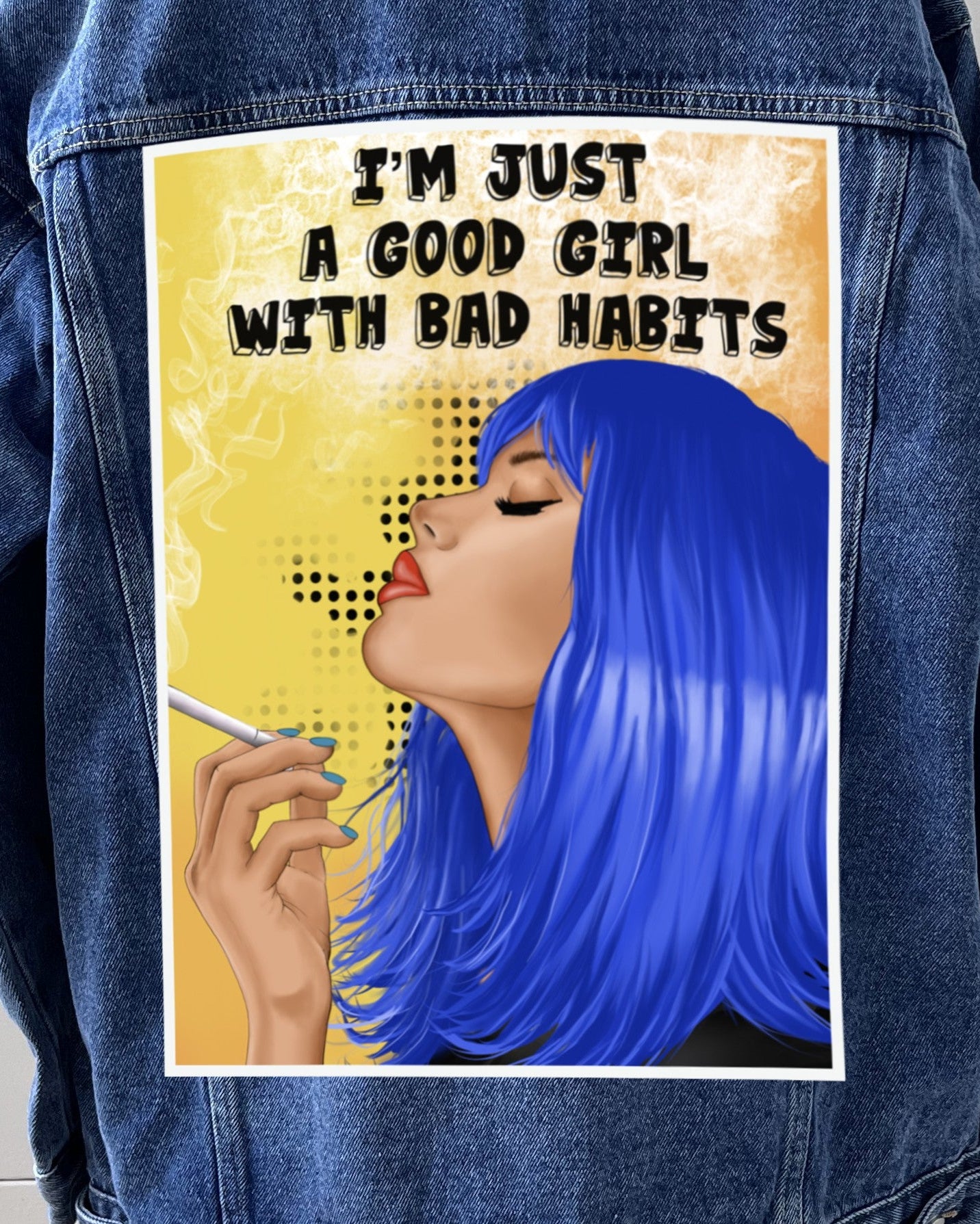 A denim jacket featuring a canvas patch with an illustration of a character with blue hair and text 'I'M JUST A GOOD GIRL WITH BAD HABITS'.