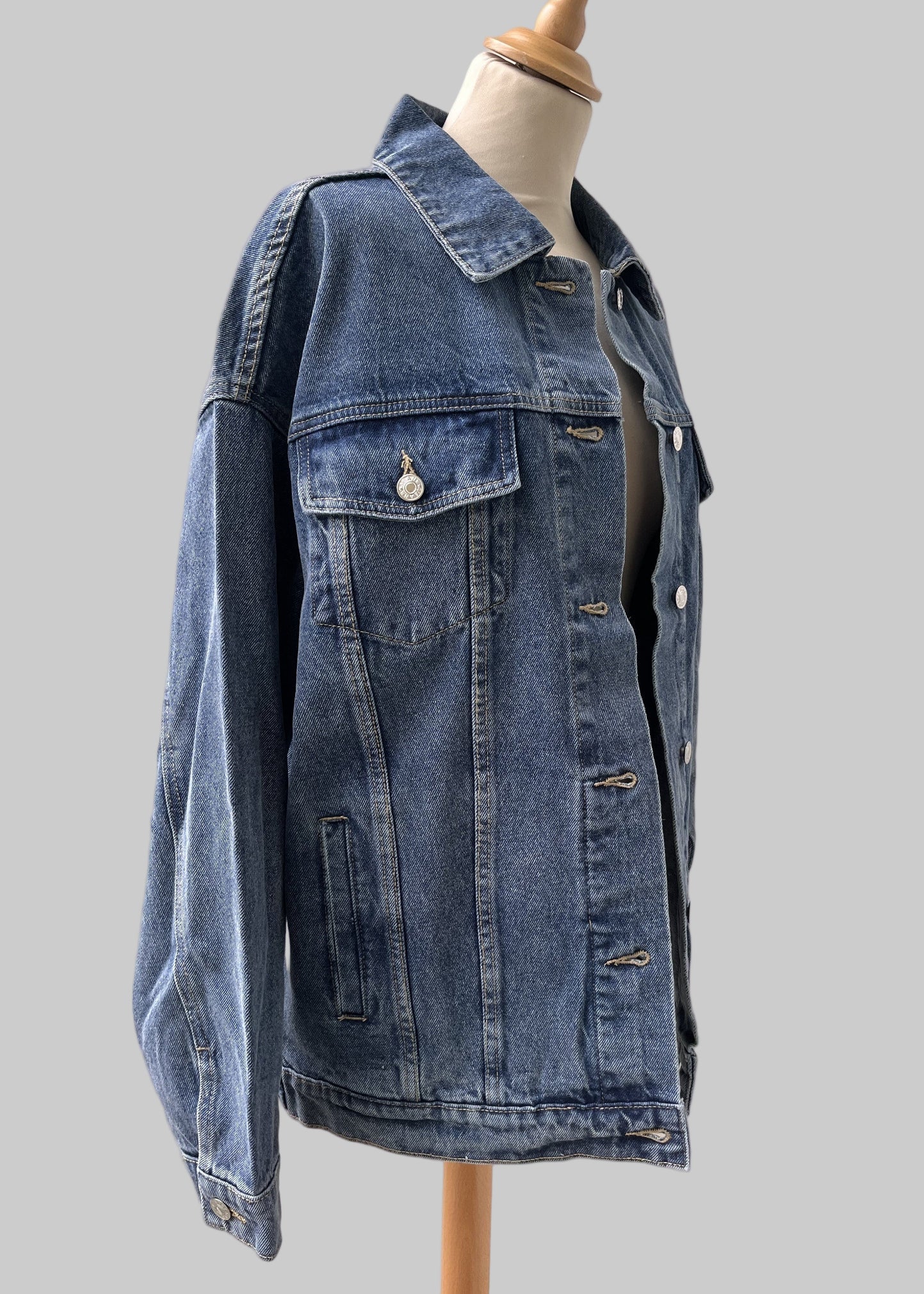 Custom denim jacket featuring abstract textile patch