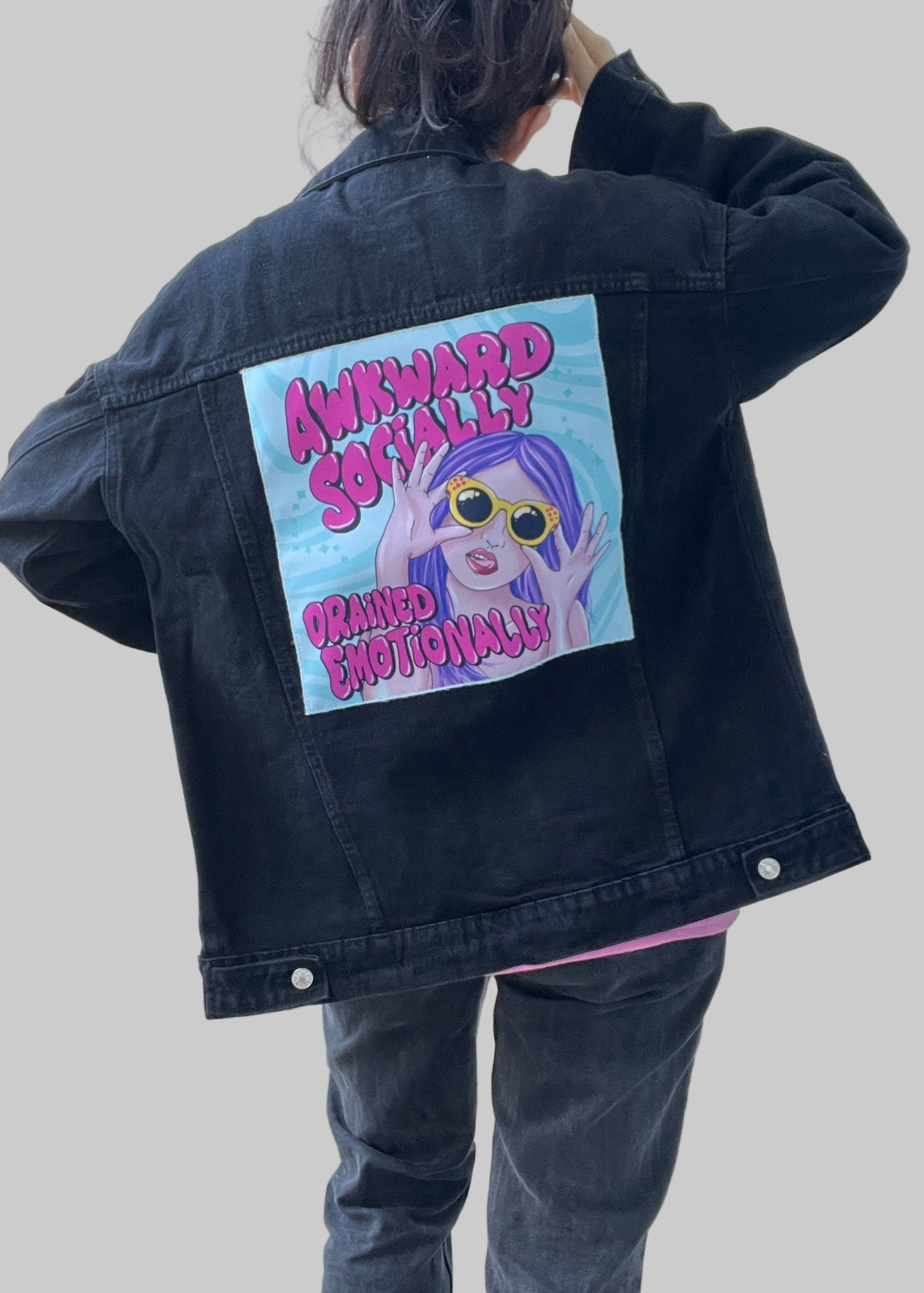 Streetwear denim jacket with colorful back patch design