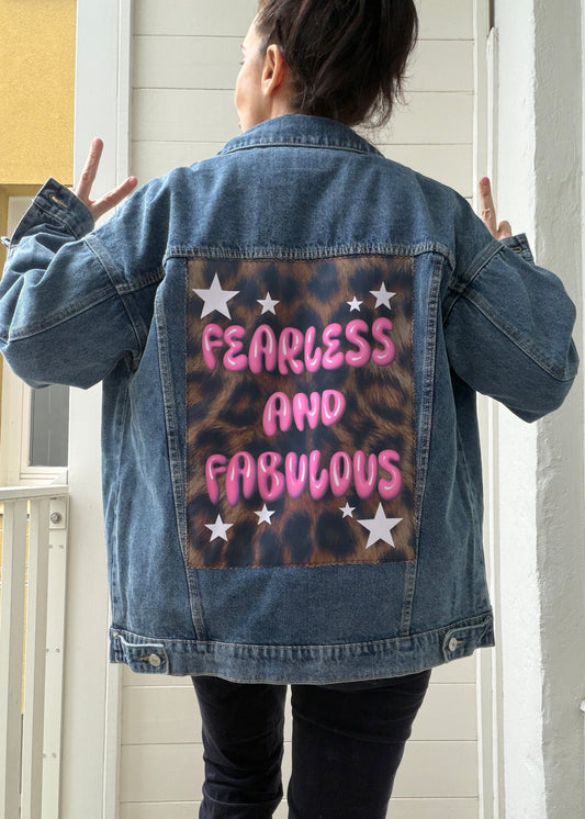 Person wearing a denim jacket with 'Fearless and Fabulous' text on the back