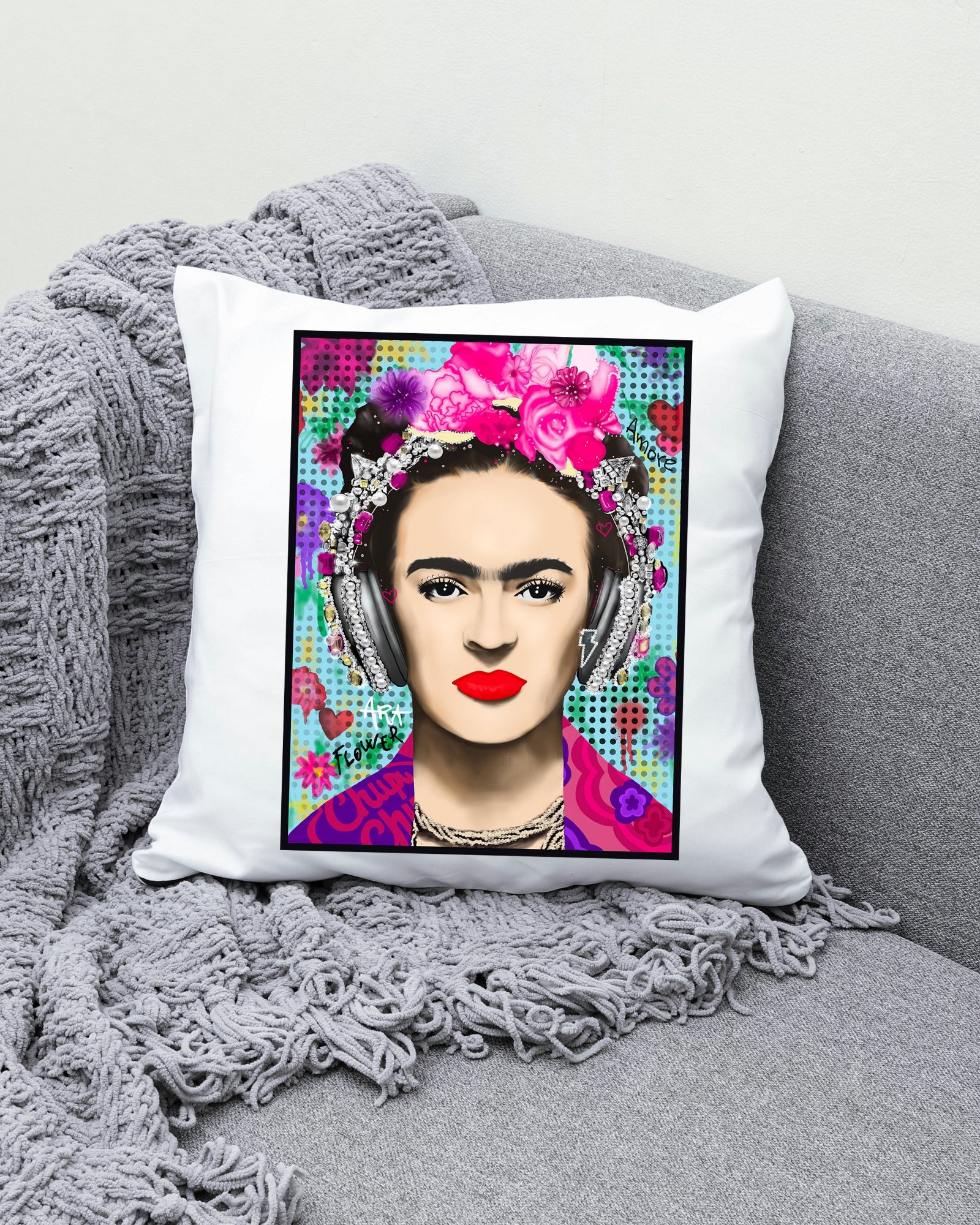 Pillow with a colorful portrait of a woman on a gray couch