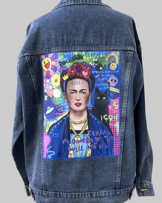 Denim jacket with a colorful painting of a famous artist on a mannequin against a white wall.