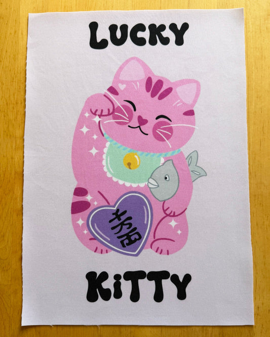 Pink cartoon cat with a fish and 'Lucky Kitty' text on a white background
