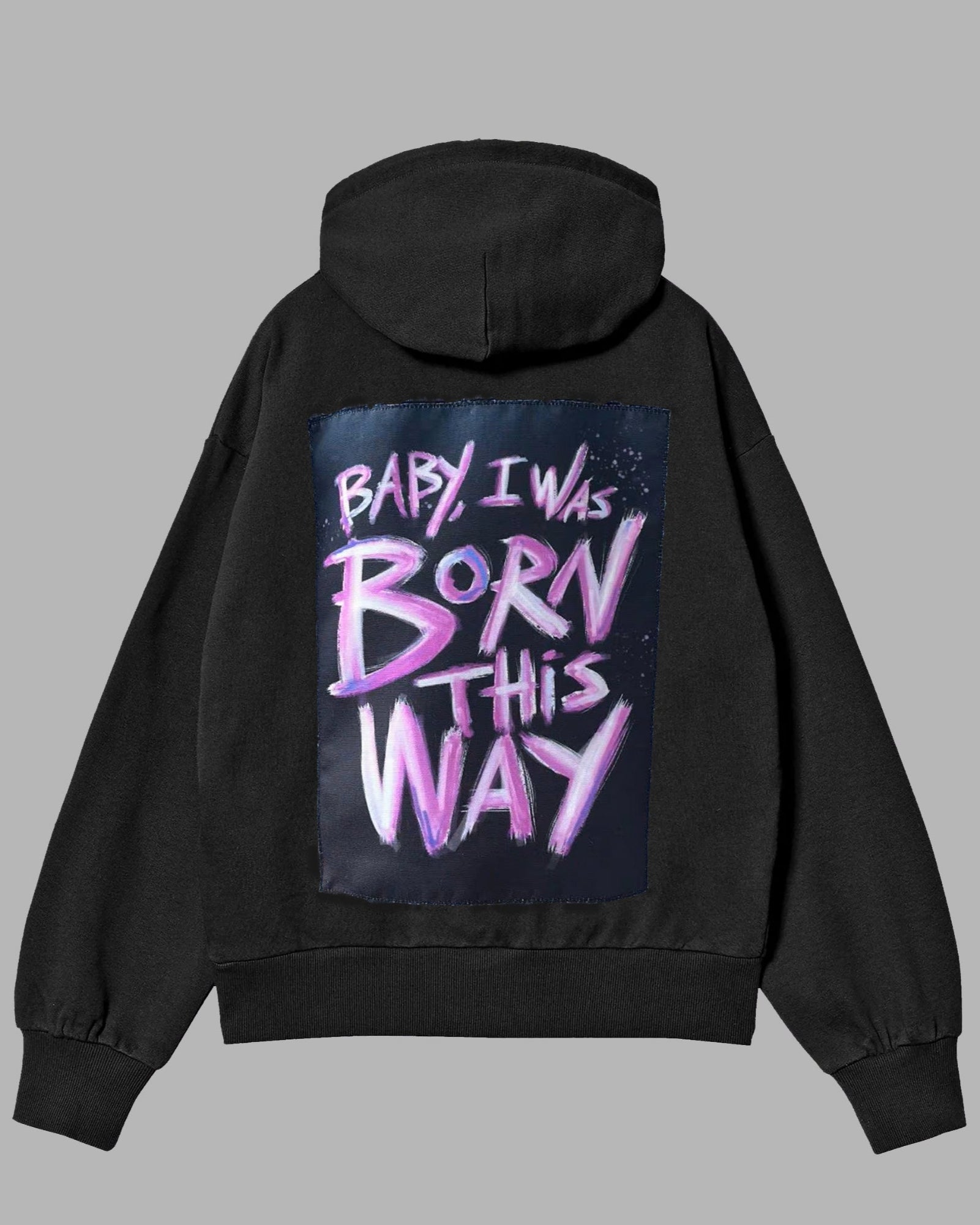 Black hoodie with colorful text on the back against a gray background