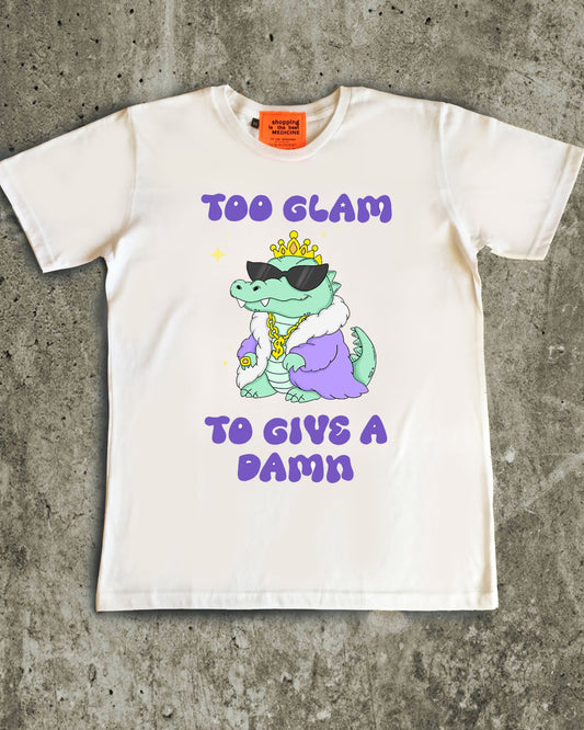 White t-shirt with a graphic of a dinosaur and text on a concrete surface