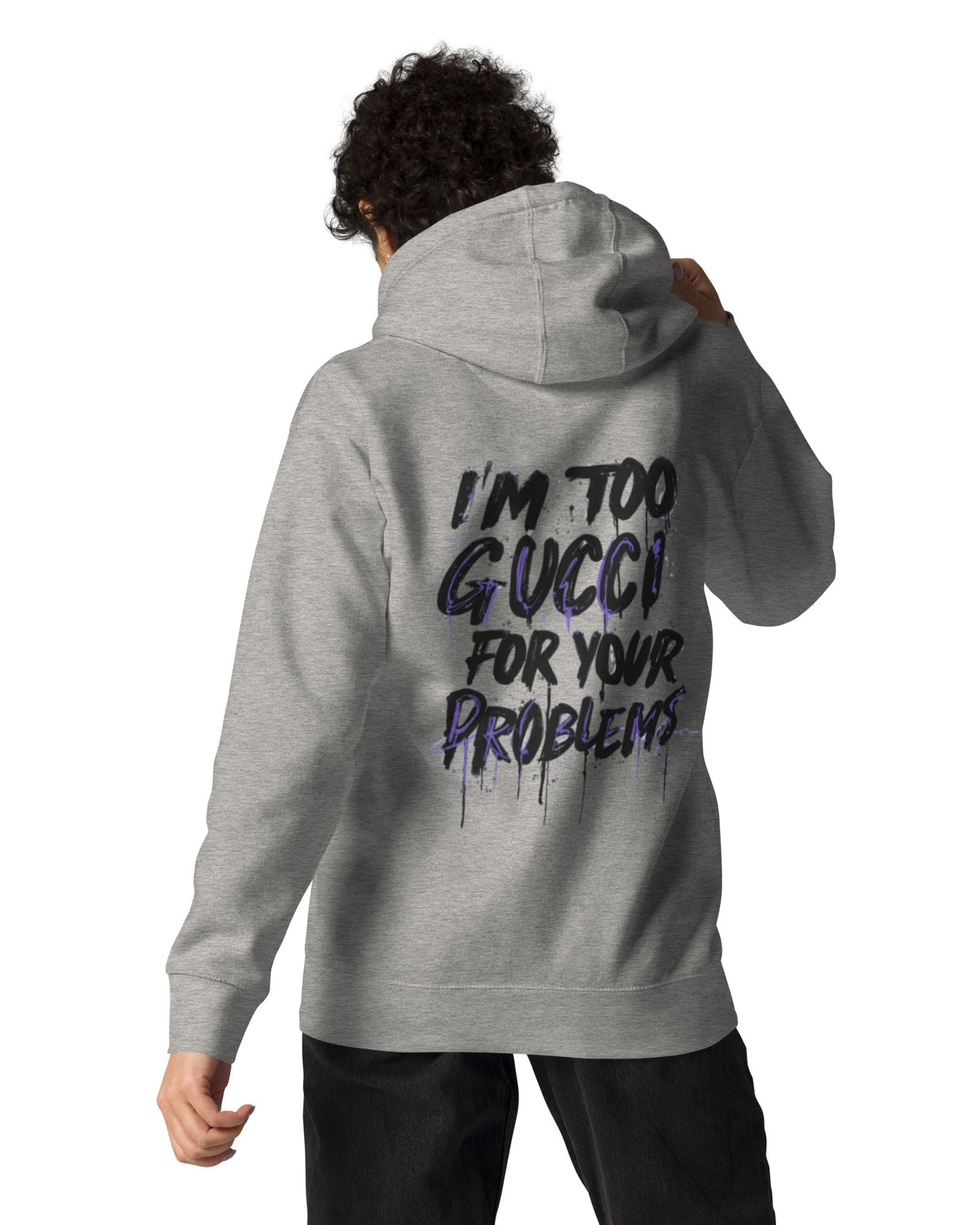 Person wearing a gray hoodie with text on the back, standing against a white background
