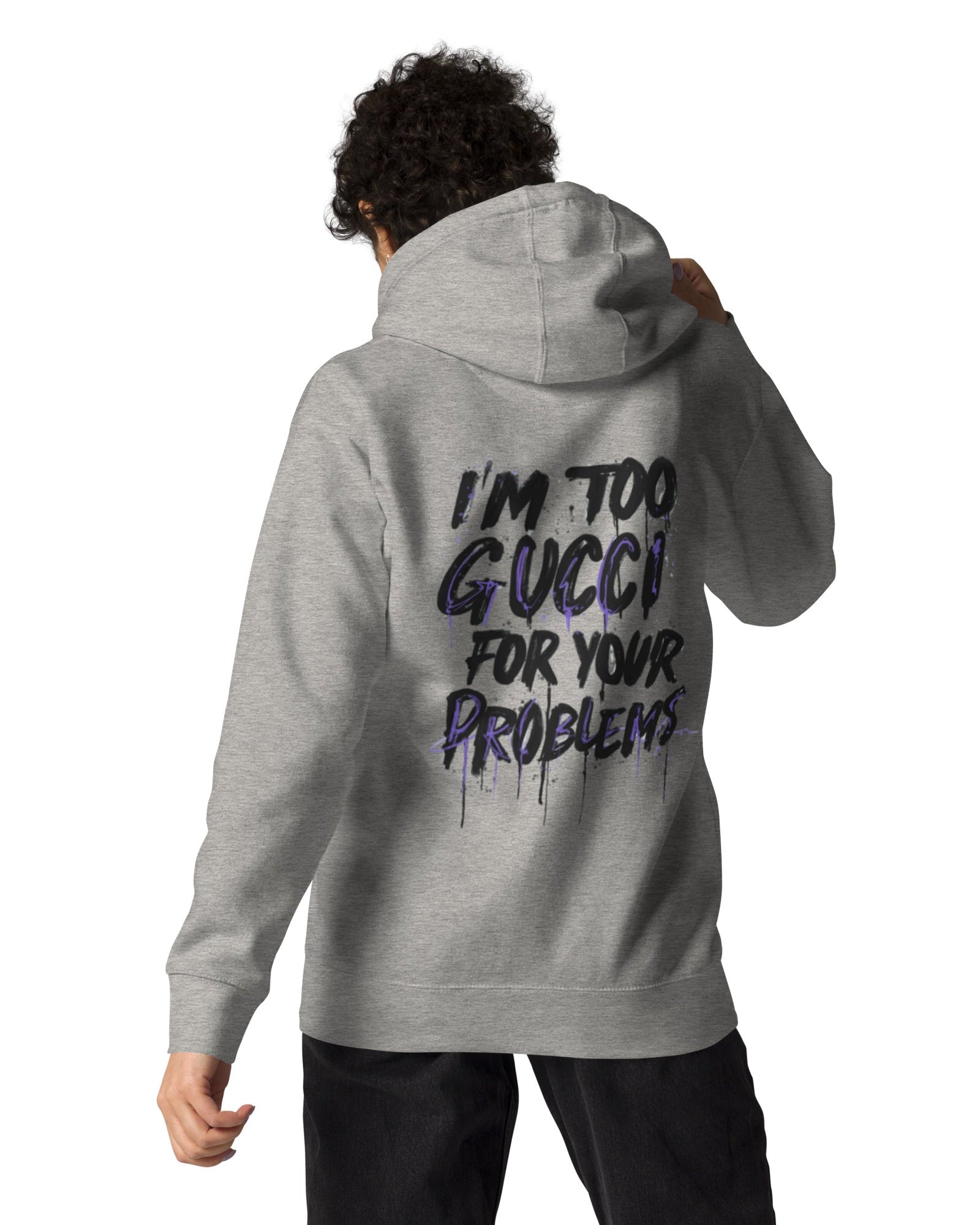 Person wearing a gray hoodie with text on the back, standing against a white background