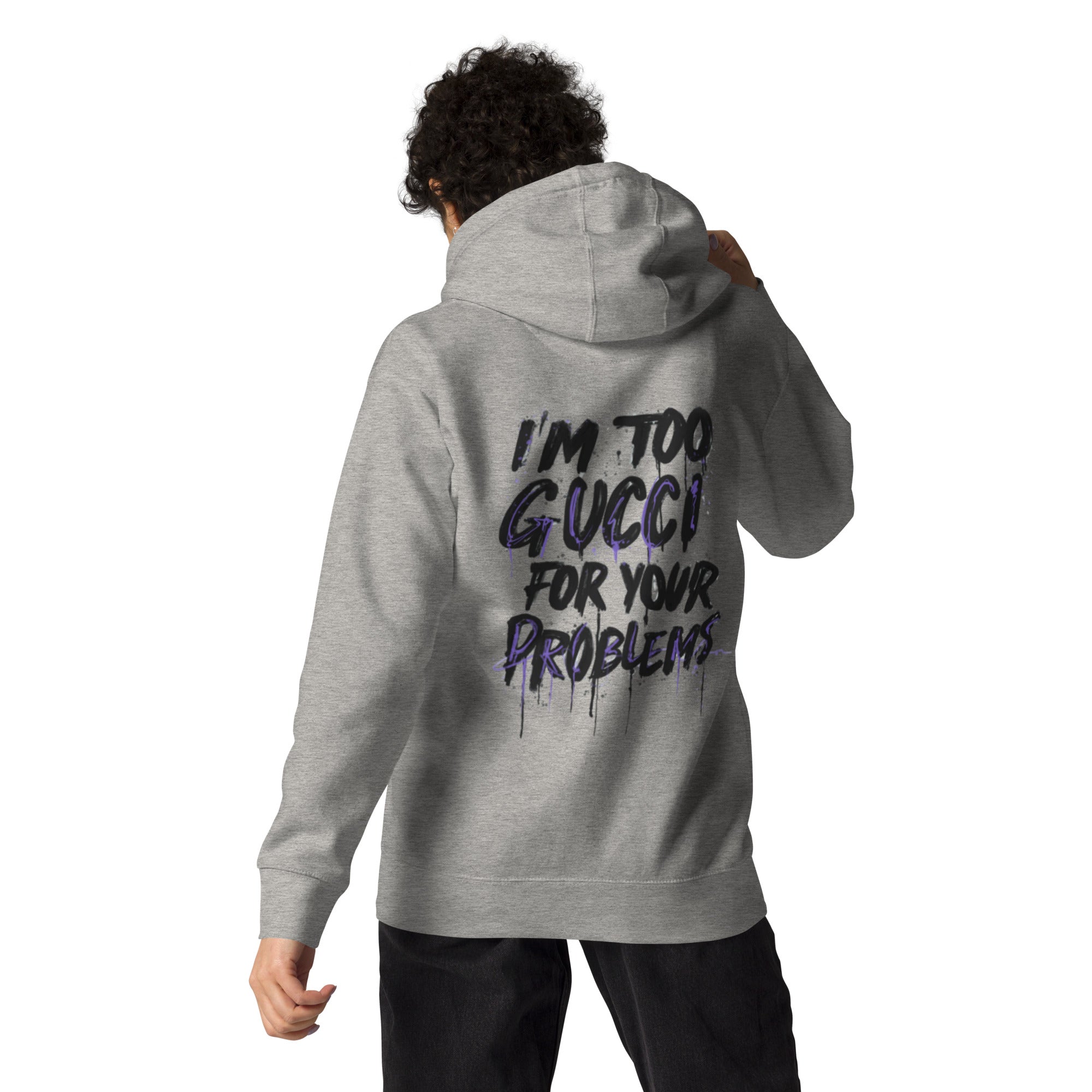 Person wearing a gray hoodie with text on the back, standing against a white background