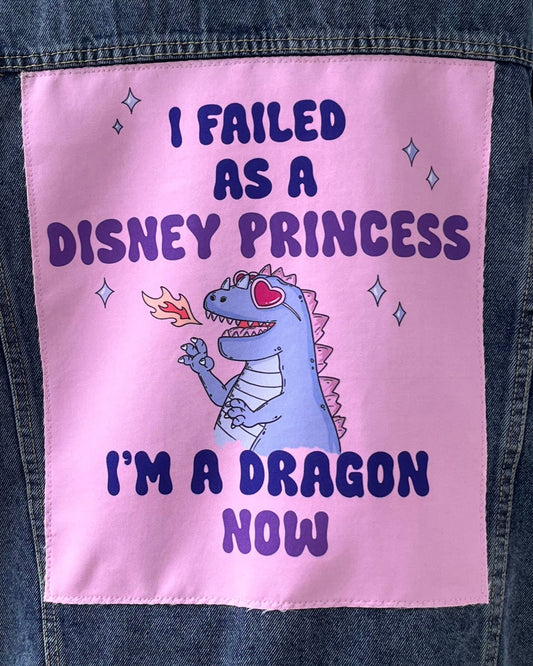 Pink patch with a dragon illustration and text on a denim jacket
