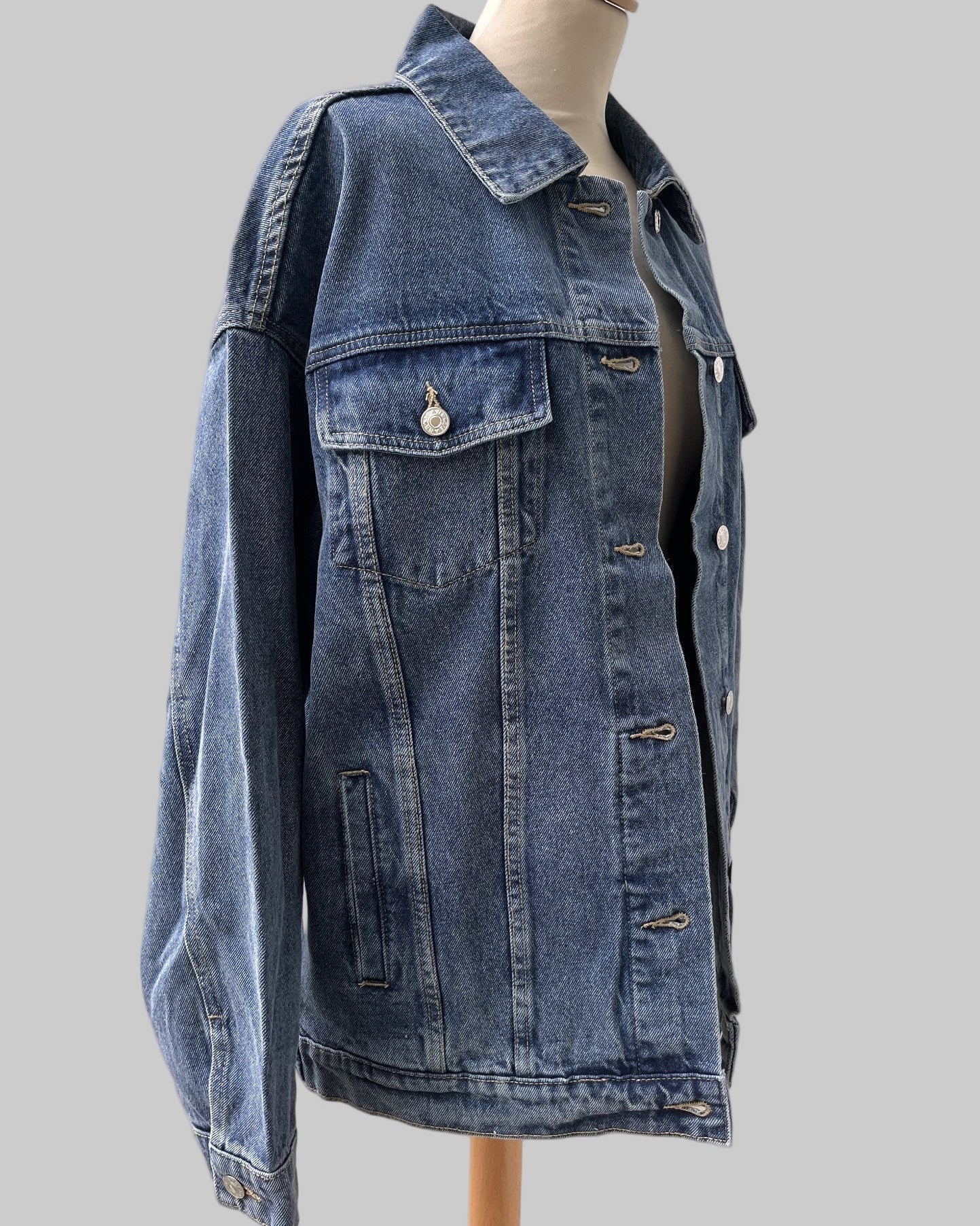 Custom denim jacket featuring abstract textile patch